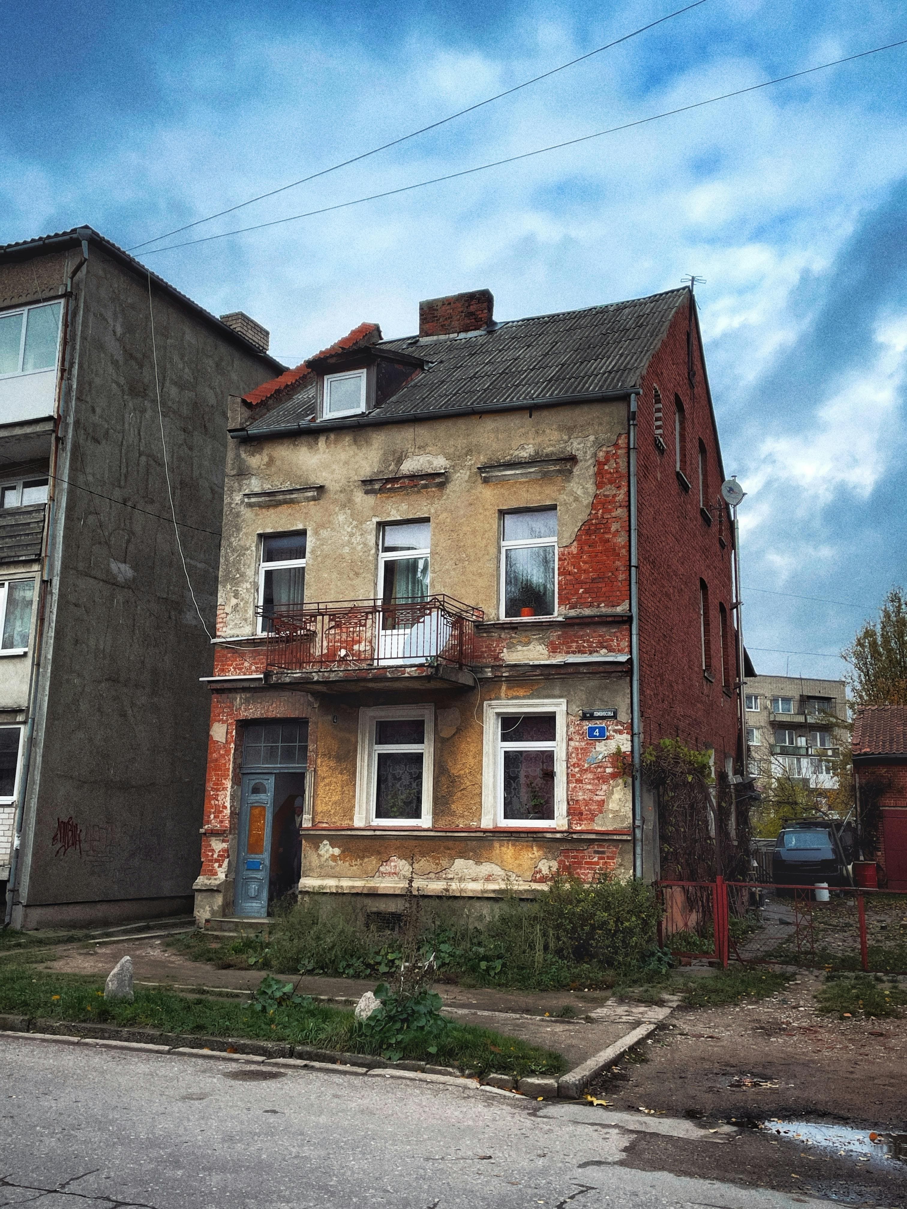 Original building facade before contemporary style AI transformation